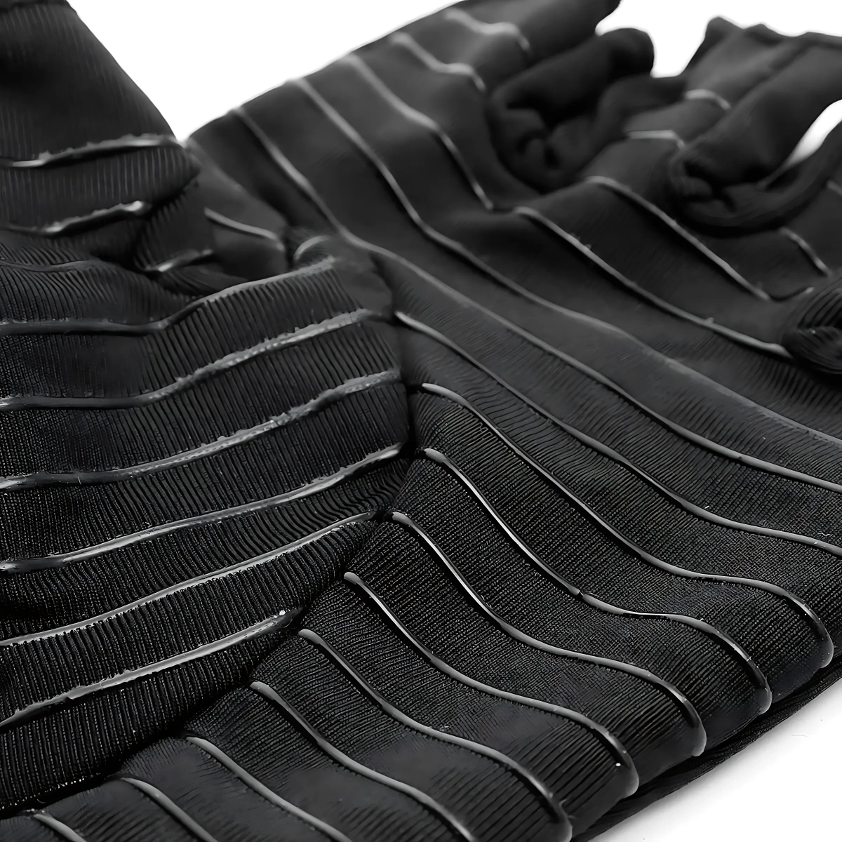 raynauds-gloves-close-up Close-up of black compression gloves displaying the silicone grip pattern and high-quality fabric for better tactile control.