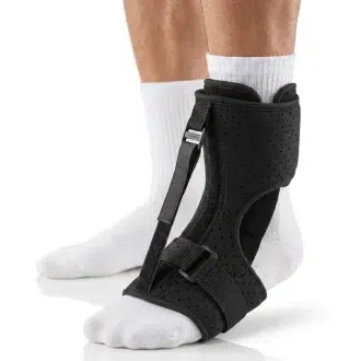 product image of man wearing white socks wearing this foot drop brace support