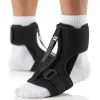 A night splint brace designed for Plantar fasciitis relief is shown on a man's foot against a clean white background. The device holds the foot in a gentle dorsiflexion position, maintaining a stretch along the Achilles tendon and plantar fascia. An adjustable tension strap secures the midfoot, allowing customizable support while padded contours ensure comfort. The rigid frame stabilizes the ankle, promoting proper alignment overnight to reduce morning stiffness. Soft, breathable materials line the interior for extended wear.